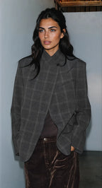 Women's dark checked blazer with high collar, long sleeves and flap pockets