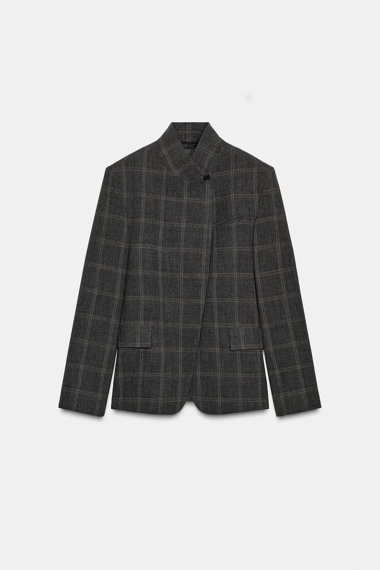 Women's dark checked blazer with high collar, long sleeves and flap pockets