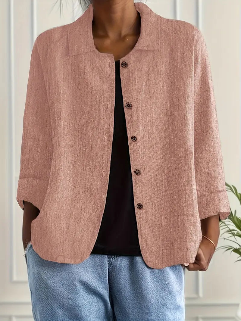 Women's button-front collared cardigan with long sleeves and rounded hem