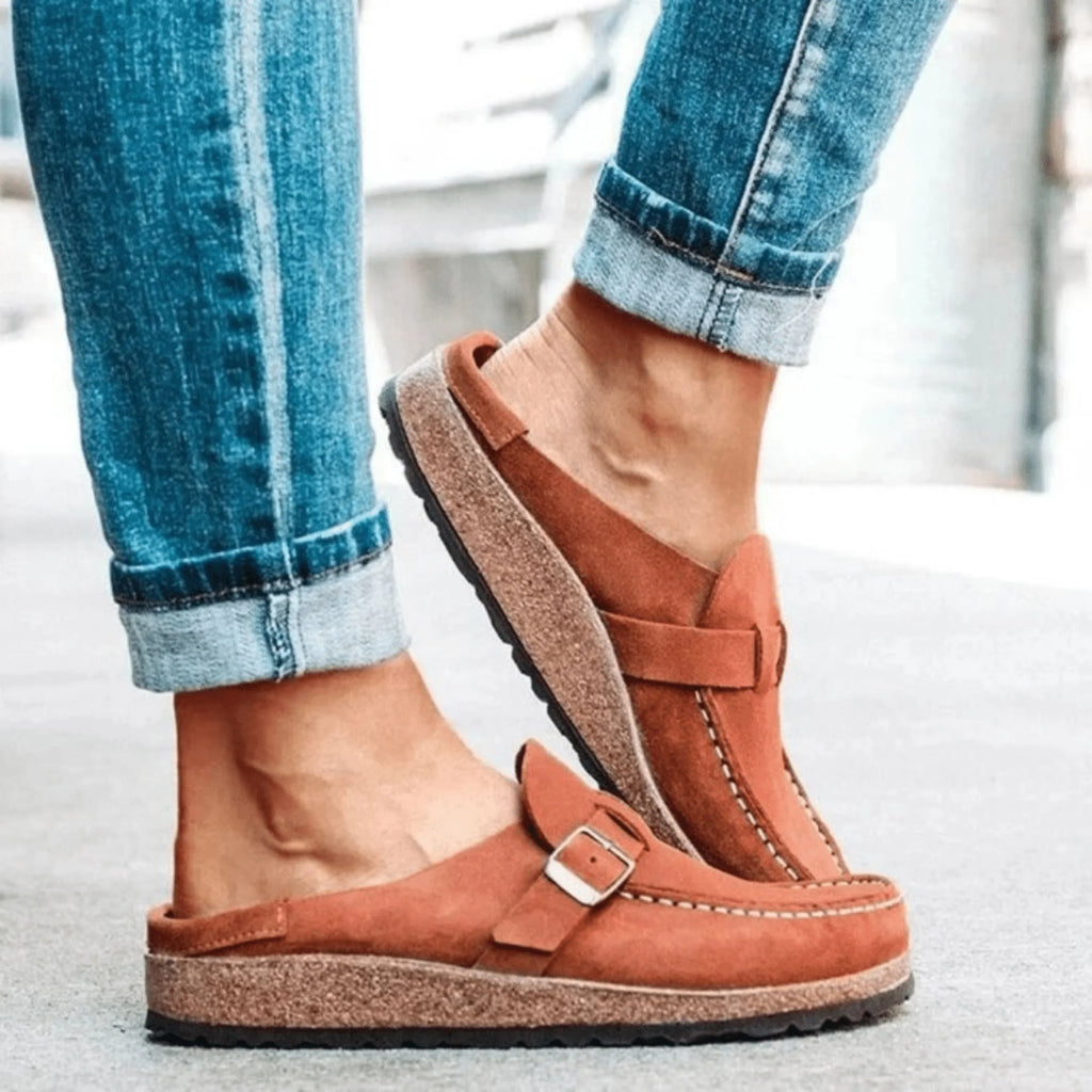 Women's moc toe loafers with buckle straps and flat textured soles