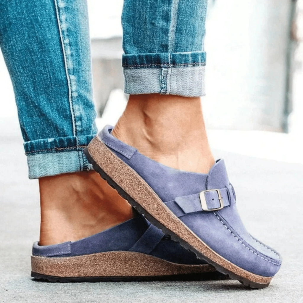 Women's moc toe loafers with buckle straps and flat textured soles
