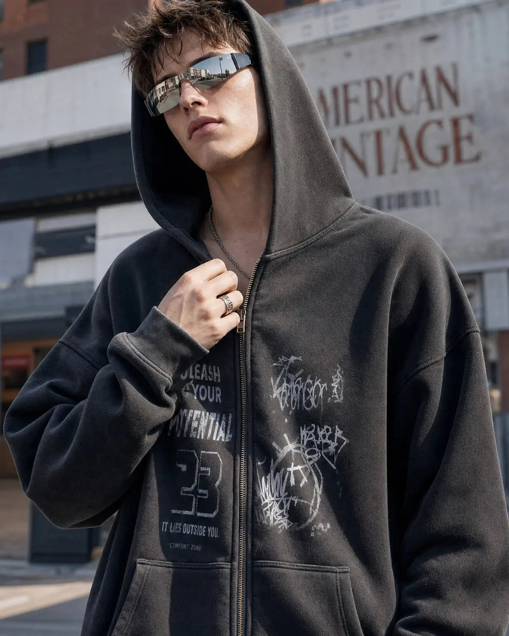 Graphic zip-up hoodie with hood, chest artwork and front pouch pockets