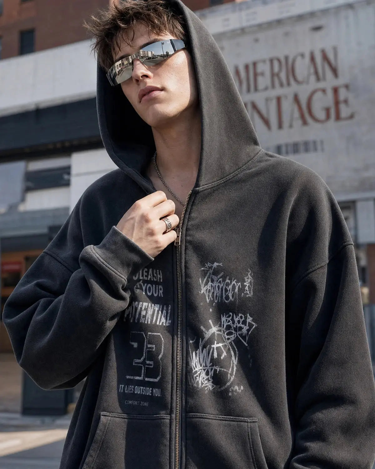 Graphic zip-up hoodie with hood, chest artwork and front pouch pockets