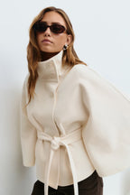 Women's cape coat with high collar, button front and tied waist belt