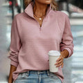 Women's ribbed quarter-zip sweater with high collar and long sleeves