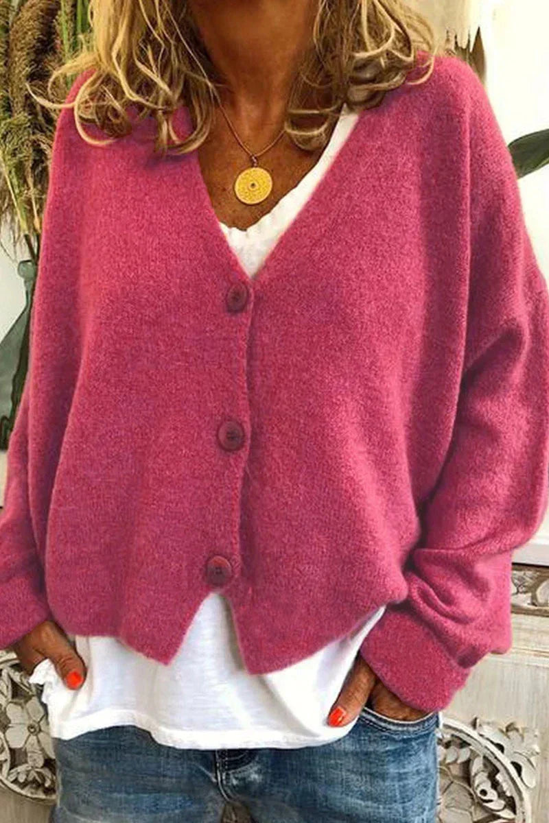 Women's long-sleeve V-neck button cardigan layered over a white top