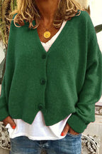 Women's long-sleeve V-neck button cardigan layered over a white top