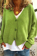 Women's long-sleeve V-neck button cardigan layered over a white top