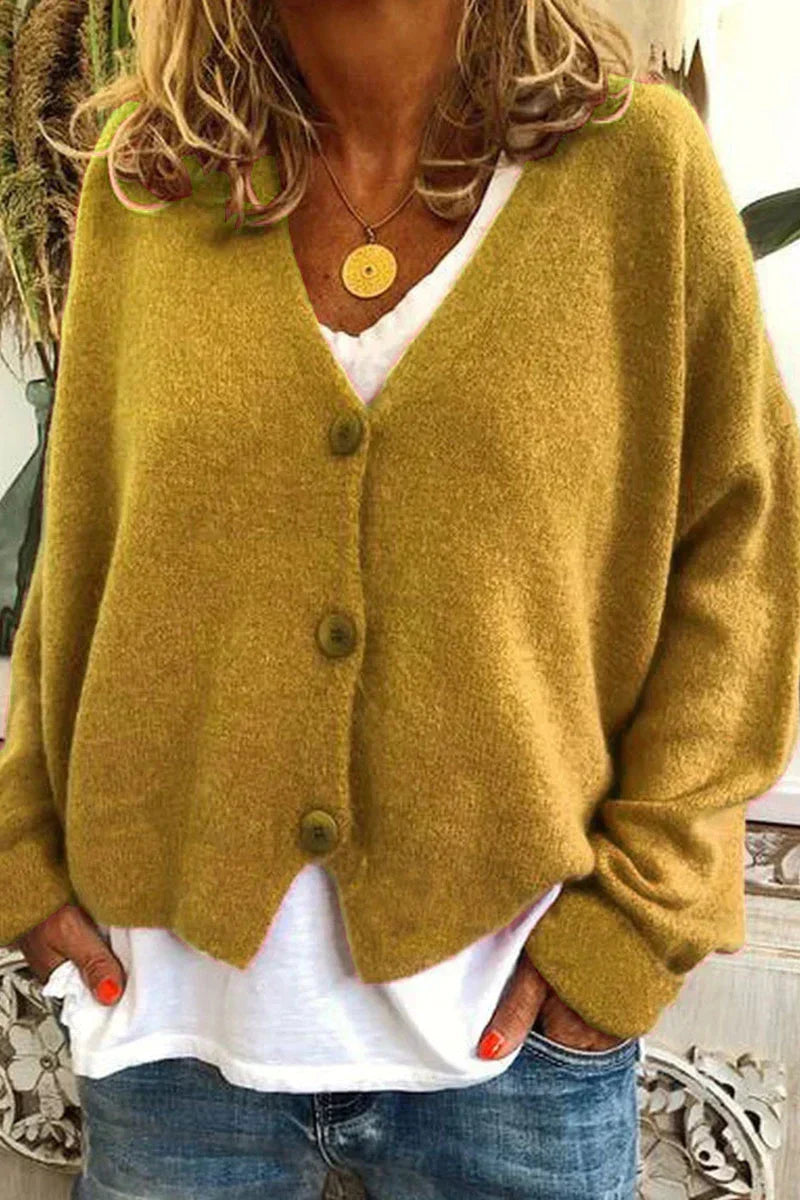 Women's long-sleeve V-neck button cardigan layered over a white top