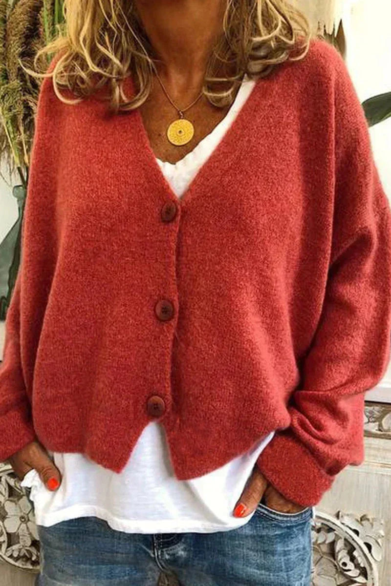 Women's long-sleeve V-neck button cardigan layered over a white top