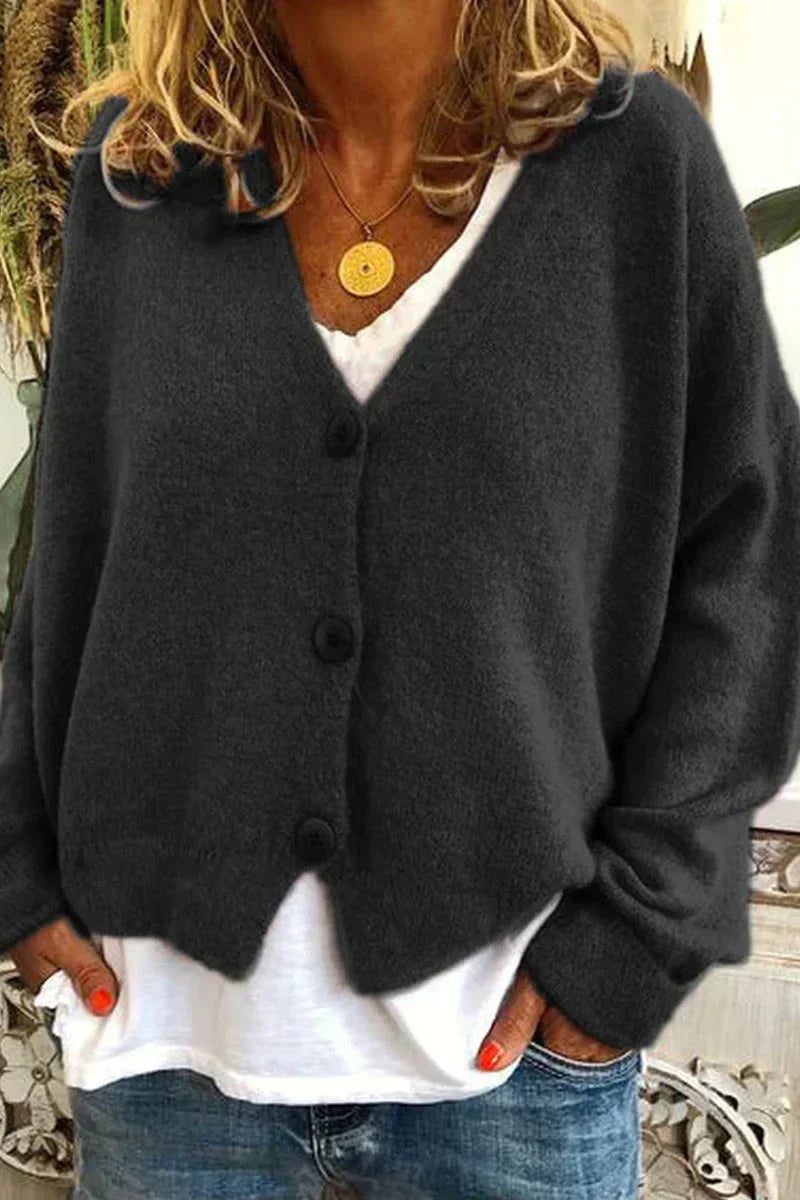 Women's long-sleeve V-neck button cardigan layered over a white top