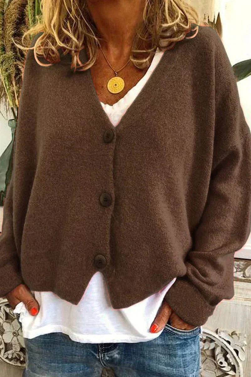 Women's long-sleeve V-neck button cardigan layered over a white top