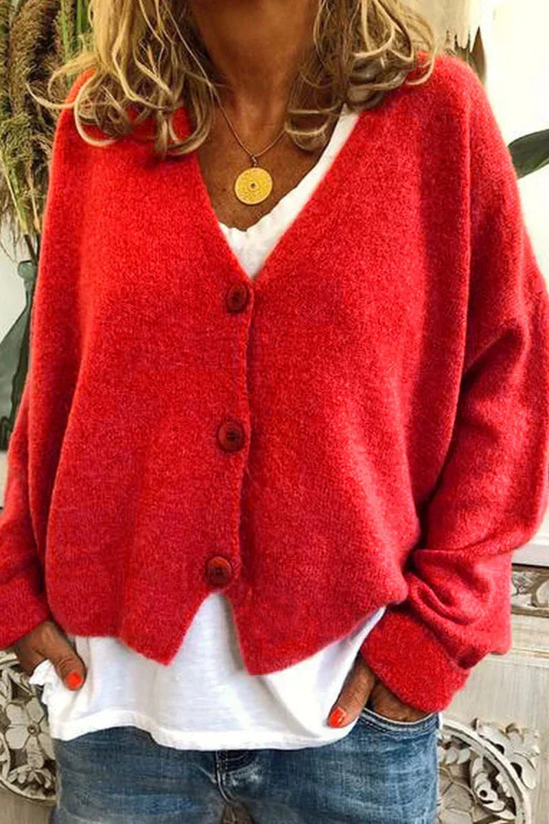 Women's long-sleeve V-neck button cardigan layered over a white top