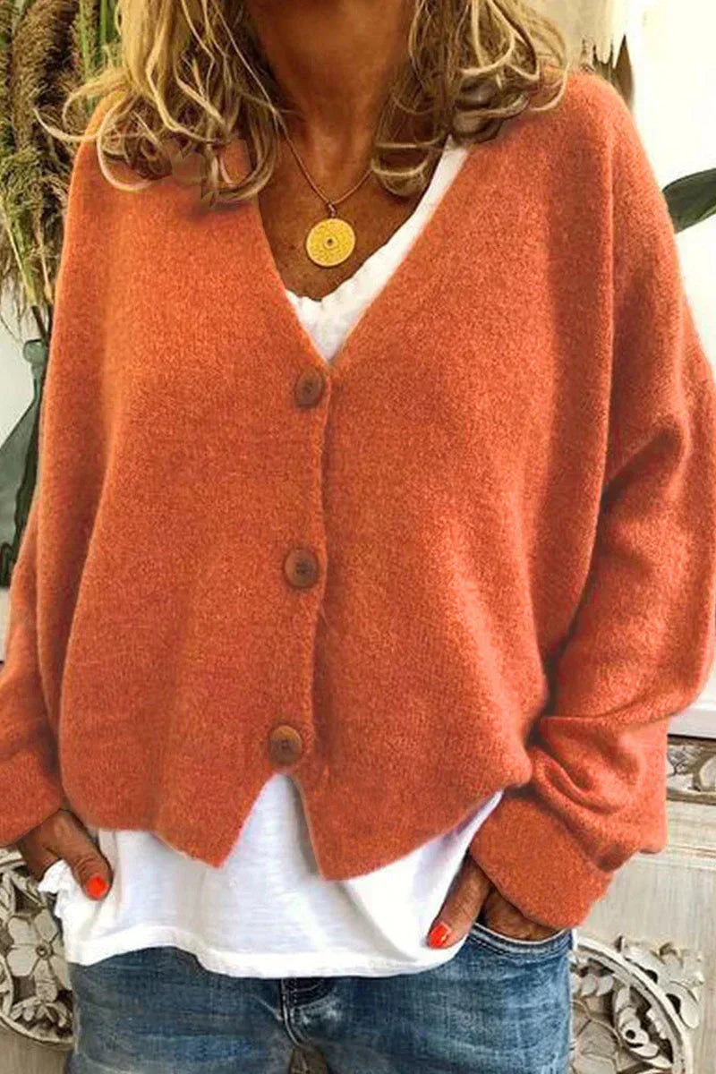 Women's long-sleeve V-neck button cardigan layered over a white top