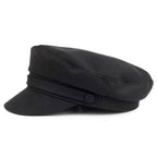 Black fiddler cap with structured crown, layered band and short brim