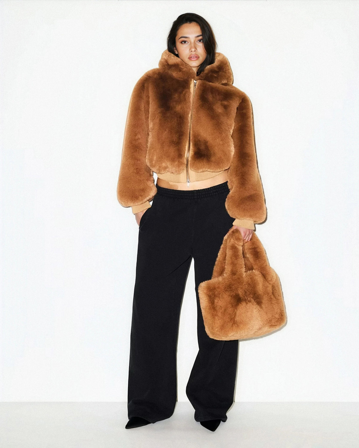 Women's cropped faux fur jacket with hood and zip front