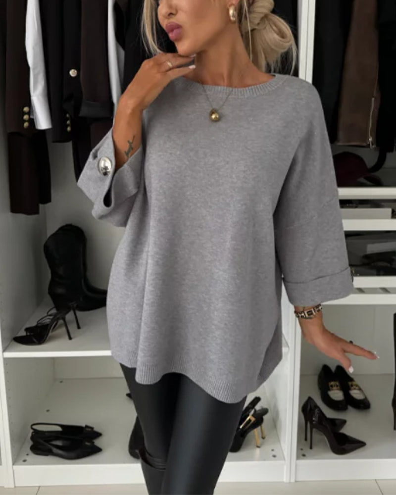 Women's knitted jumper with round neckline, three-quarter sleeves and button cuffs
