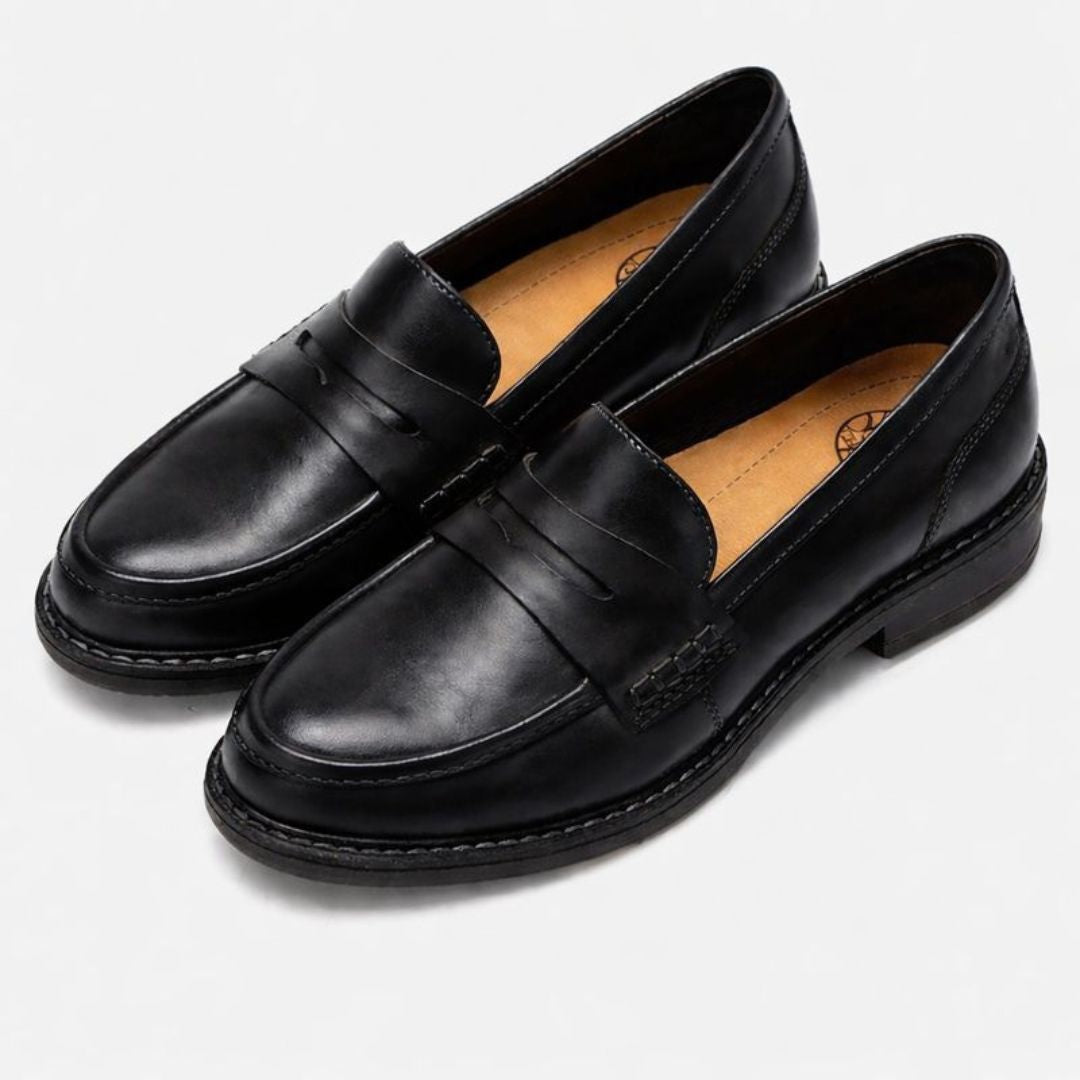 Men's slip-on penny loafers with rounded toes, stitched soles and low flat heels
