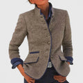Women's tailored button-front cardigan with stand collar, long sleeves and flap pockets