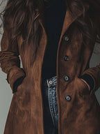 Women's long button-front coat with lapel collar and side pockets