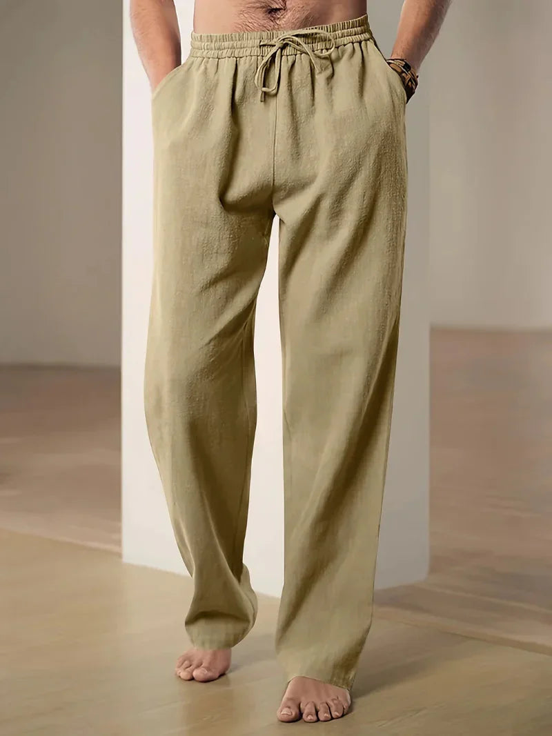 Men's plain straight-leg trousers with an elasticated drawstring waist and side pockets