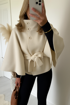 Women's belted cape coat with high collar, buttons and draped sleeves