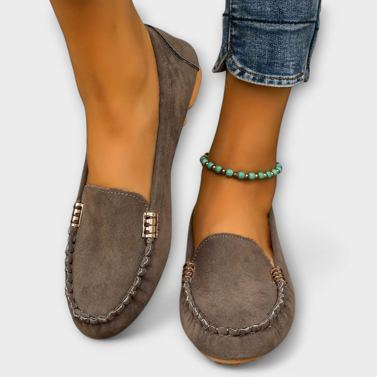 Slip-on loafers with rounded toes, braided stitching and metallic side details