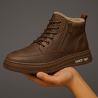 Shearling-lined lace-up ankle boot with side zip and flat treaded sole
