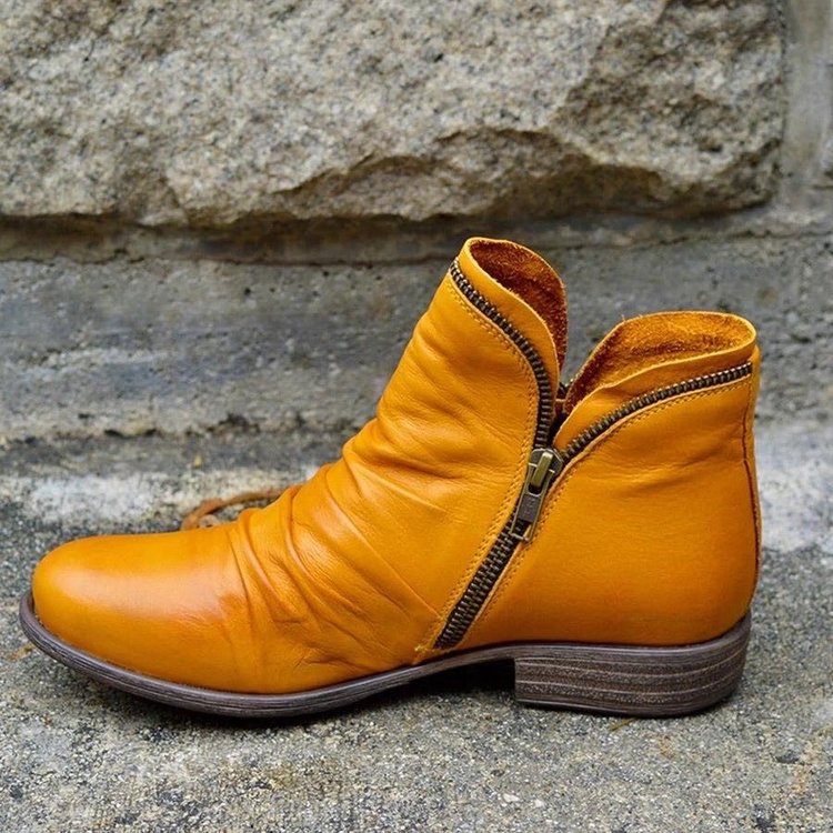 Women's ankle boots with side zips, ruched detailing and low heels