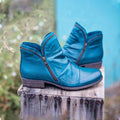 Women's ankle boots with side zips, ruched detailing and low heels