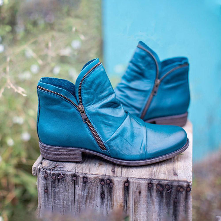 Women's ankle boots with side zips, ruched detailing and low heels