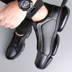 Black men's slip-on athletic trainers with chunky sculpted soles