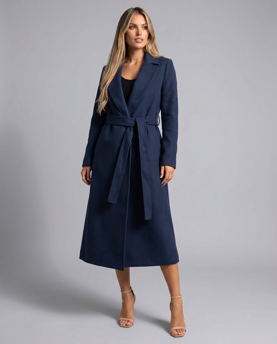 Women's navy longline trench coat with lapels, long sleeves, side pockets and tie belt