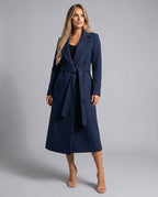 Women's navy longline trench coat with lapels, long sleeves, side pockets and tie belt