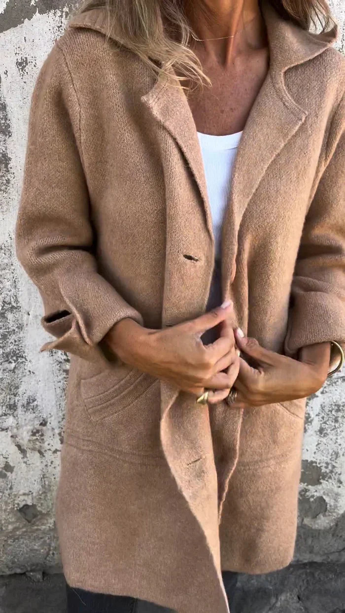 Women's longline button front coat with notched lapels and long sleeves