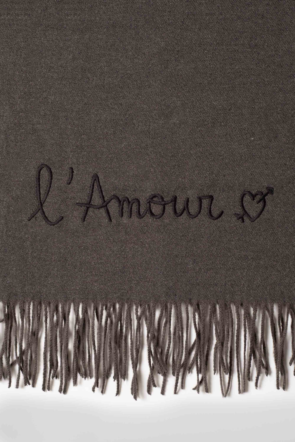 Rectangular fringed scarf with embroidered love message and heart motif