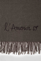 Rectangular fringed scarf with embroidered love message and heart motif