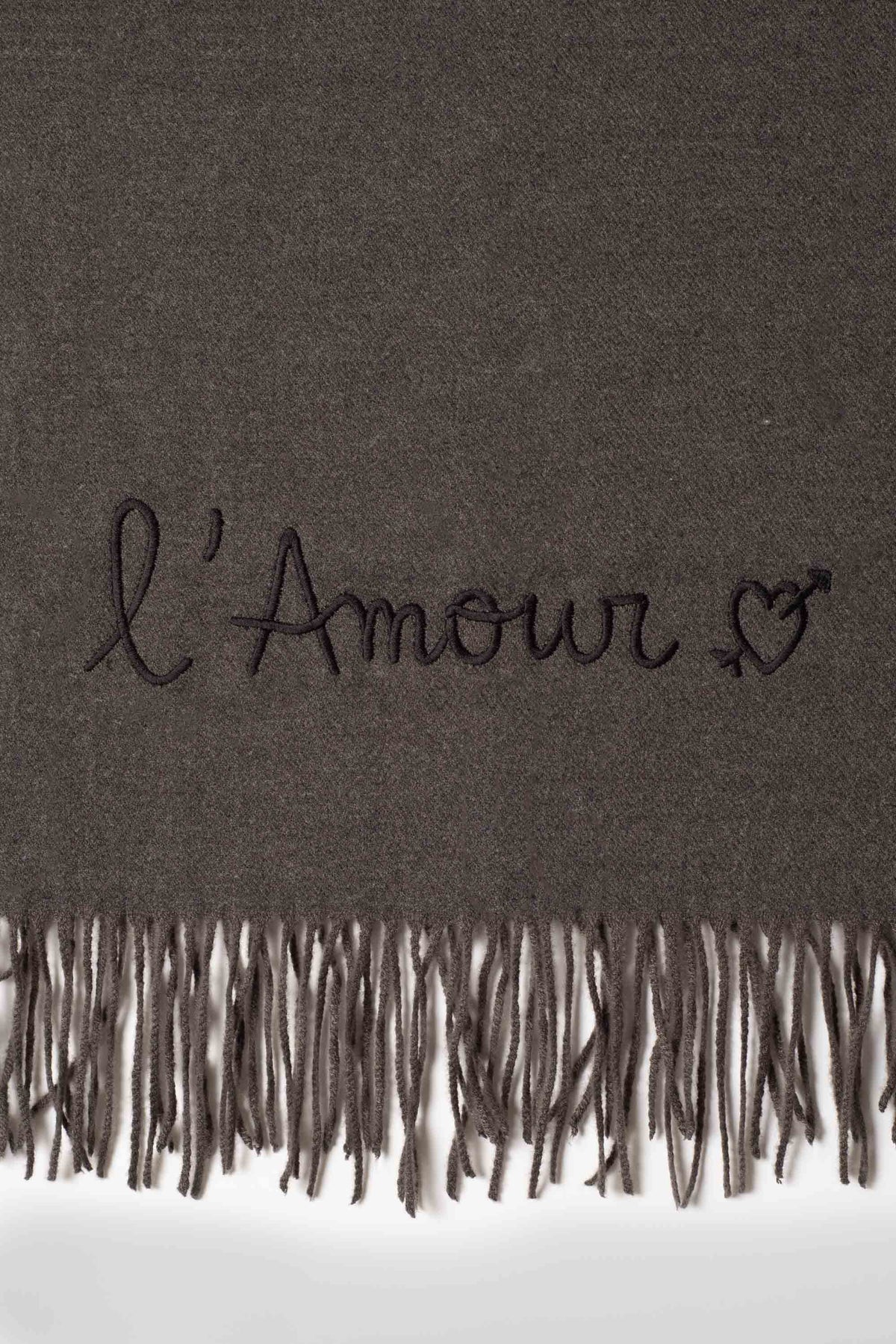 Rectangular fringed scarf with embroidered love message and heart motif