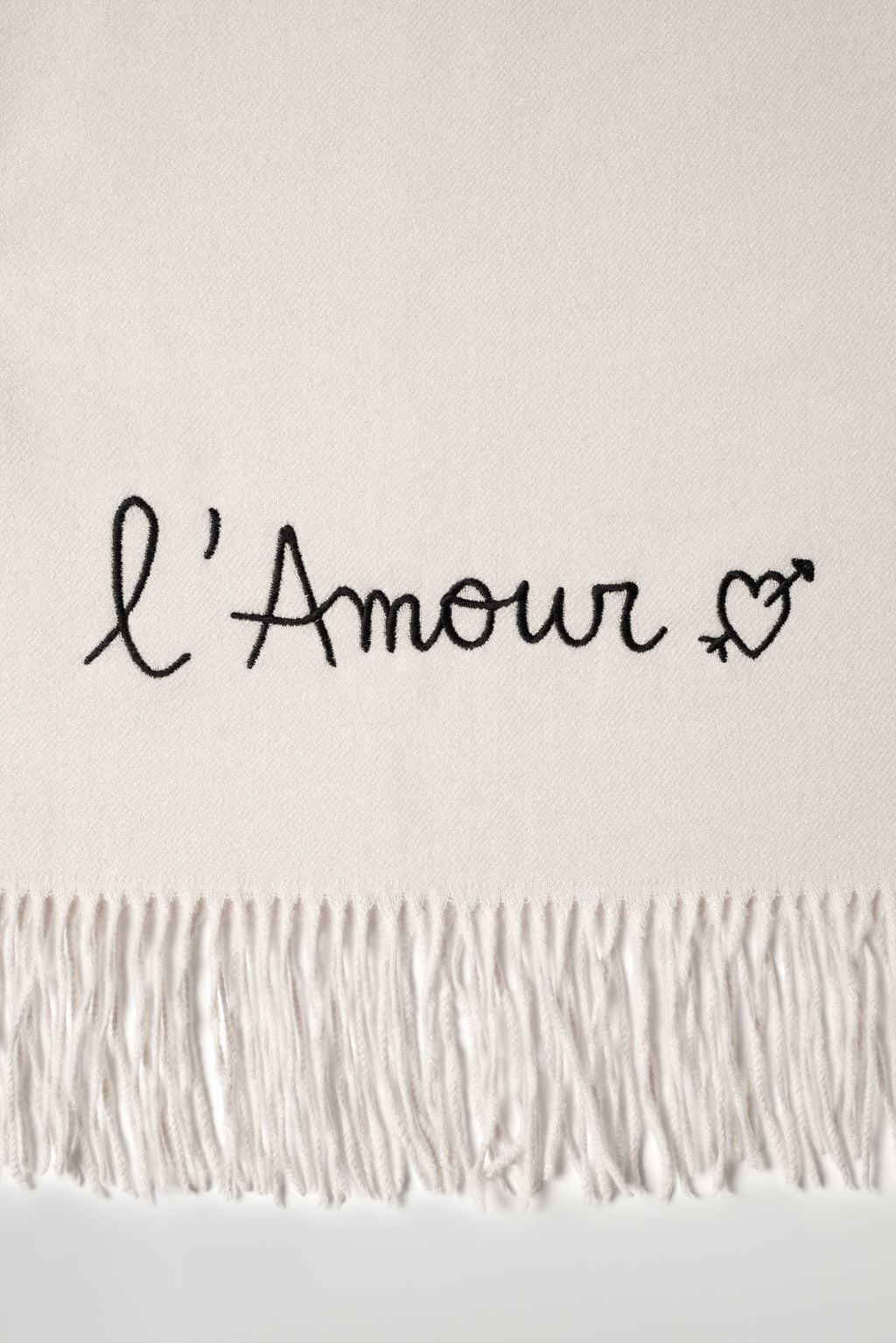 Rectangular fringed scarf with embroidered love message and heart motif