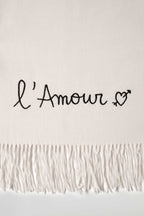 Rectangular fringed scarf with embroidered love message and heart motif