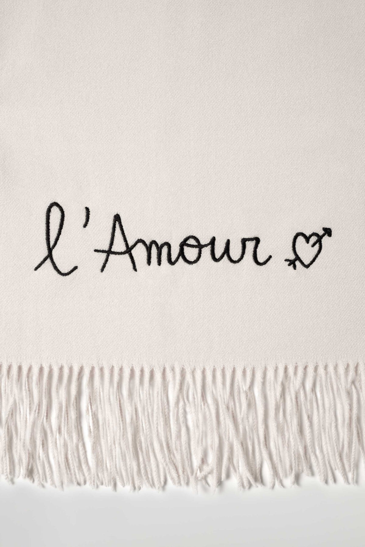 Rectangular fringed scarf with embroidered love message and heart motif
