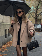 Women's oversized short coat with wide collar, long sleeves, buttons and front pockets