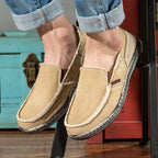 Casual slip-on loafers with rounded toes, stitched uppers and flat textured soles