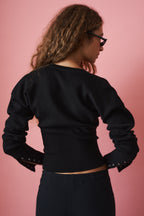 Women's black cropped cardigan with round neck, long sleeves and front buttons