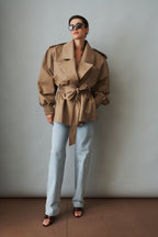 Women's beige tie-waist trench coat with wide lapels and gathered long sleeves