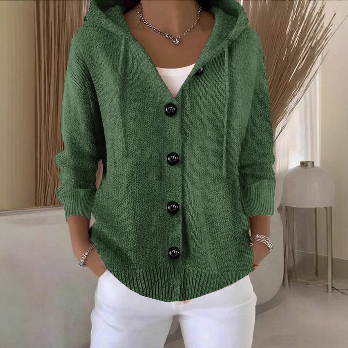 Women's hooded knitted cardigan with buttons, long sleeves and front pockets