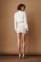 Women's cream cropped V-neck cardigan with long sleeves and button front