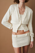Women's cream cropped V-neck cardigan with long sleeves and button front