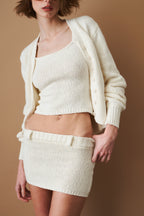 Women's cream cropped V-neck cardigan with long sleeves and button front