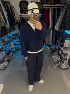 Navy long-sleeve zip hoodie with hood and front pouch pockets